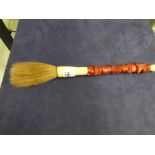 Coral handled brush