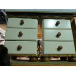 A pair of waxed pine and cream finished three drawer bedside chests