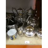 A quantity of silver plated teapots, jugs etc.