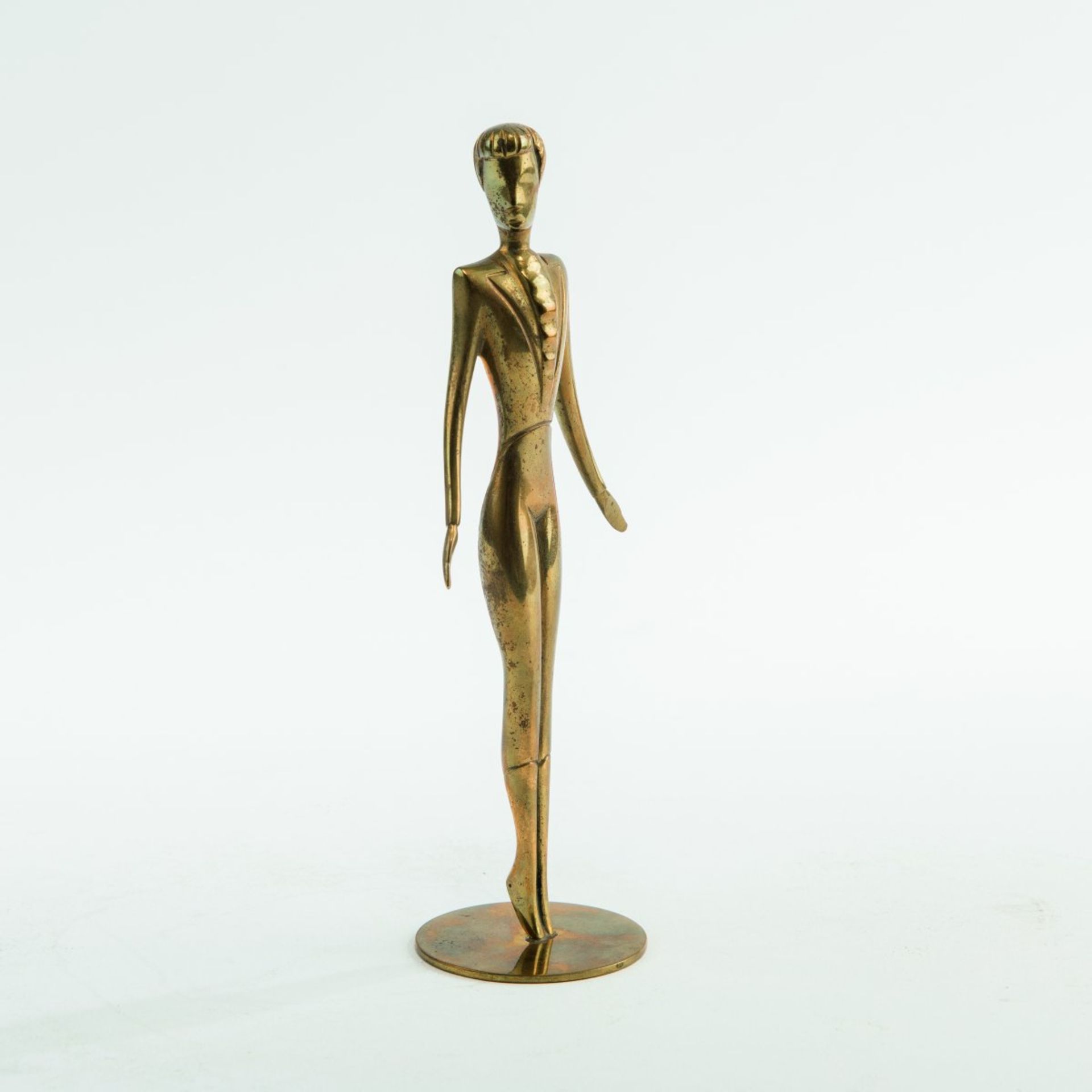 Hagenauer, Vienna, 'Girl in a suit', c. 1930'Girl in a suit', c. 1930H. 17 cm. Cast brass. Signed: