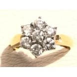 An 18ct yellow gold diamond cluster ring, the seven round diamonds of over half a carat, claw set in