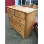 A late Victorian satin walnut chest of drawers, with two short and three long graduated ribbed