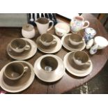 A Poole mushroom glazed tea set; and other handpainted floral Poole ware including a jug, a jam