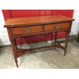 An Edwardian mahogany dressing table, the rectangular top with moulded edge above two frieze