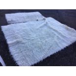 Two sheepskin style rugs. (2)