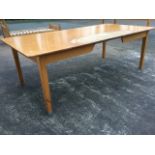 A rectangular worktable with composition top on plain rails, one rail with kneehole shaping,