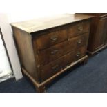 A nineteenth century walnut chest of drawers, the crossbanded top above two short and two long