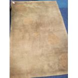 An Indian rectangular fireside wool rug, the pile woven with roundels. (69.5in x 45.5in)