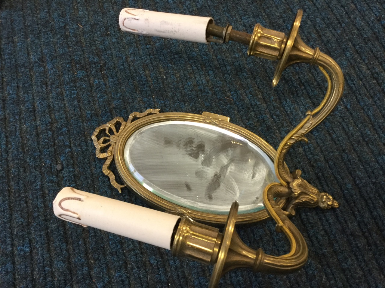 A brass wall sconce with oval bevelled mirror back and two scrolled branches holding candlelights; - Image 3 of 3
