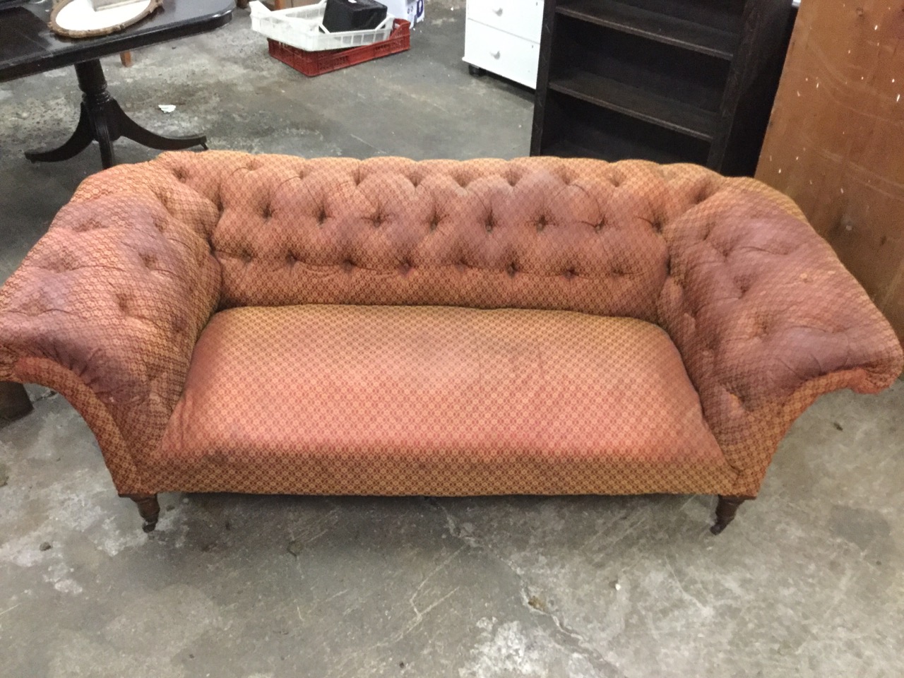 A Victorian chesterfield sofa with button upholstery and sprung seat, raised on turned tapering - Image 3 of 3