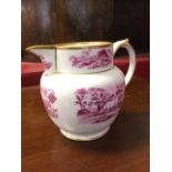A nineteenth century porcelain jug transfer printed with agricultural vignettes framed by gilt