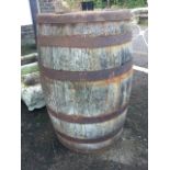 A 3ft oak barrel, the staves bound by six metal strap bands. (36in)