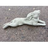 A composition stone model of a recumbent hare looking at the stars. (26in)
