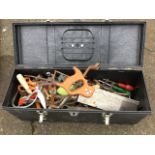 A box of tools including spanners, pliers, ratchets, screwdrivers, trowels, saws, hammers, etc.,