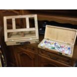 A Winsor & Newton wood paintbox with hinged table easel; and a rectangular Reeves paintbox