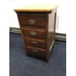 A dwarf oak cabinet with four drawers and panelled sides.