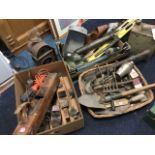 A quantity of tools including planes, an army trench spade, pumps, a trowel, a brass horn, a box