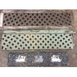 Two rectangular metal latticework panels in old wood frames; and a pierced cast panel with ducks and