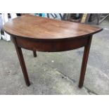 A nineteenth century mahogany dining table end of 'D' shape outline, with plain frieze raised on