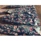 A set of four lined cotton curtains, printed with pink and orange flowers on green ground, the