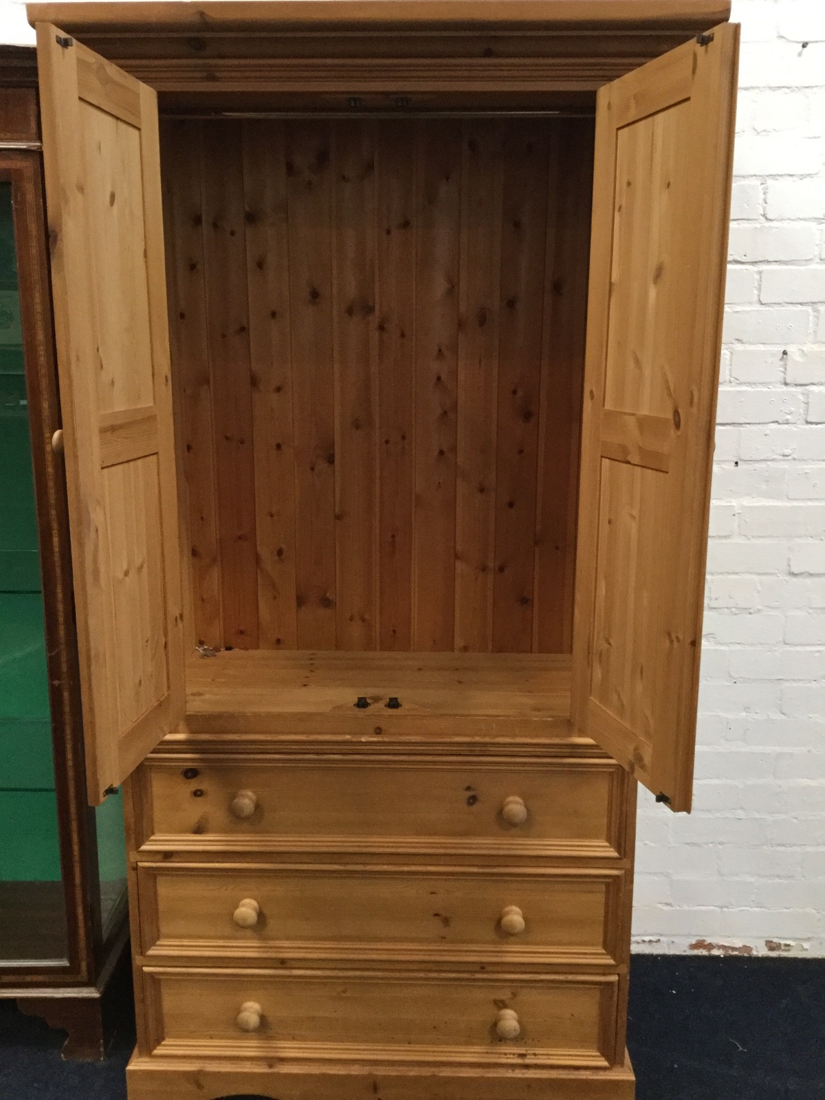 A Victorian style pine press with moulded cornice above panelled doors enclosing hanging space, - Image 3 of 3