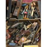Two boxes of tools - planes, chisels, drills, brushes, rulers, oil cans, a blowlamp, trowels,