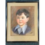 C Usher, pastel portrait of a boy, dated 1942, signed, mounted & framed. (12in x 15in)