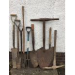 Miscellaneous tools including two peat shovels, a pitch fork, a pick axe, two draining shovels, a