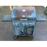 A George Foreman gas barbecue with hinged hood above a grill flanked by side platforms, with