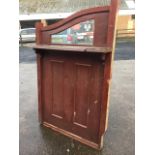 A panelled bar divider with moulded shelf beneath glazed panel in shaped frame. (40in x 62in)
