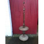 A Victorian carved standard lamp table, having pierced twisted column above an acanthus leaf collar,