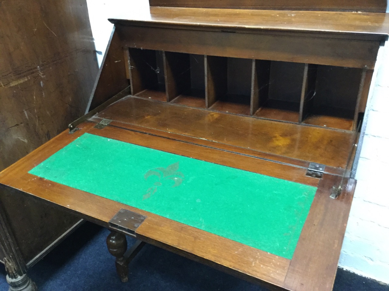 An oak bureau with panelled fallfront enclosing an interior with pigeonholes, above two long - Image 2 of 3