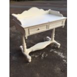 A Victorian style white painted washstand, with shaped gallery on rectangular top above two panelled