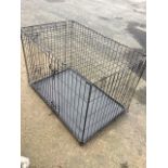 A rectangular dog cage, the folding box with hinged door having tray base. (36in x 22in x 25in)