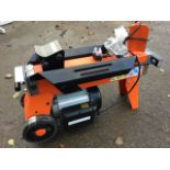 A brand new electric log splitter on stand, with trolley style wheels - serial number YYL8032.