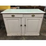 A Victorian painted pine dresser base, with moulded top above two frieze drawers mounted with