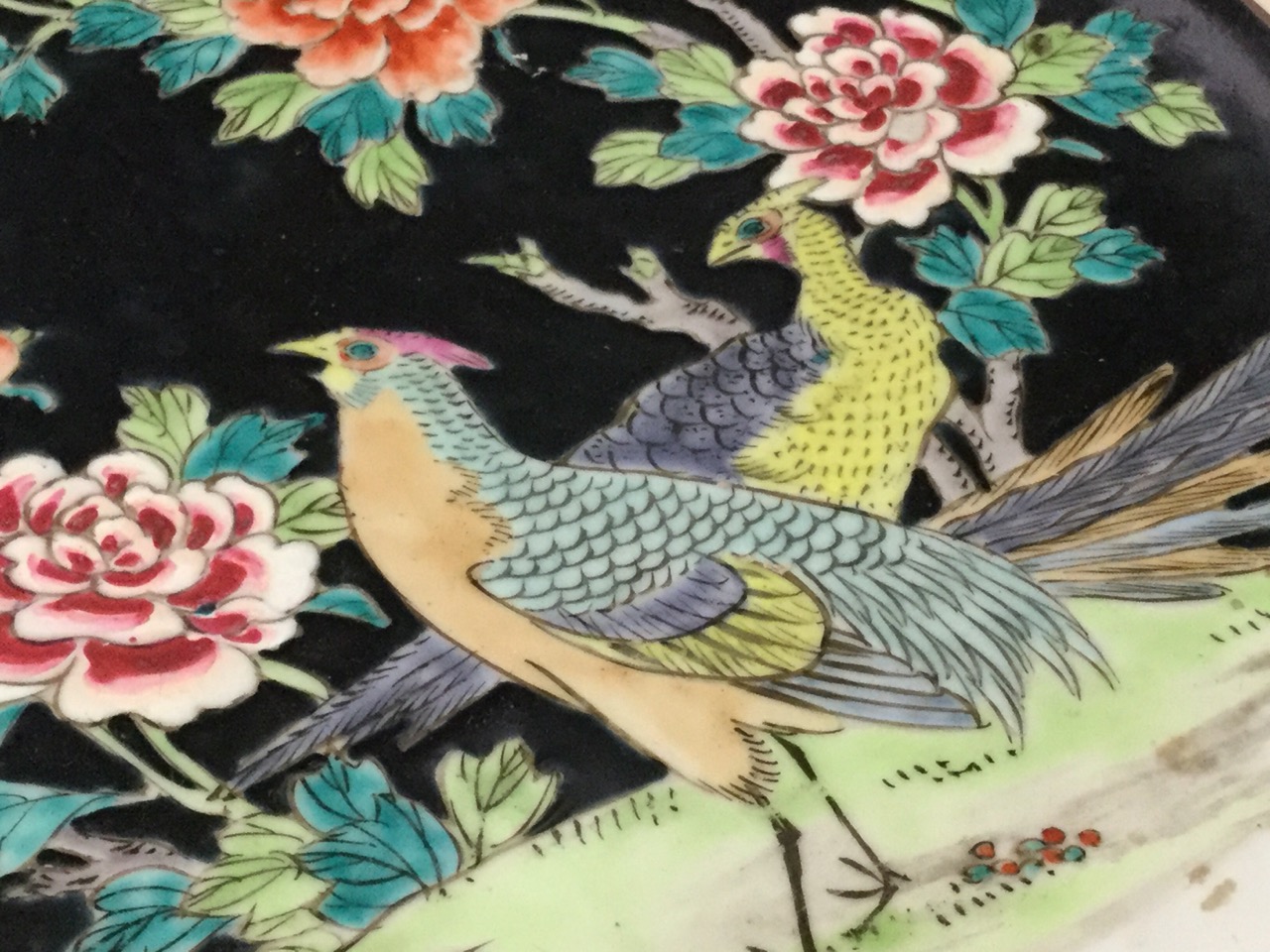 A porcelain charger decorated in an oriental palette with exotic birds, prunus blossom and - Image 3 of 3