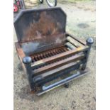 A rectangular dog grate with panelled fireback and square bars framing grill, the front