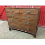 A nineteenth century mahogany crossbanded chest of drawers, the two short and three long boxwood