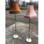 A brass standard lamp with fluted column on circular base, fitted with hexagonal shade; and