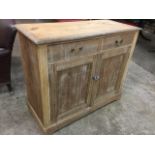 A late Victorian satin walnut cabinet with two drawers above panelled cupboards with applied press