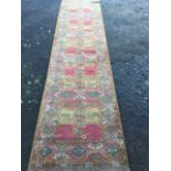 A Belgium made Mossoul style runner woven with geometric field framed by border of serrated