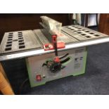 An electric table saw bench with 10in adjustable blade, guide, hinged guard, etc.