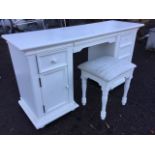 A modern dressing table with upholstered stool, the rectangular moulded top on pedestals with a