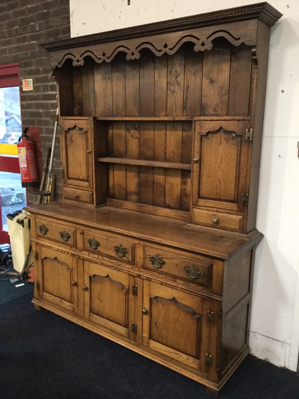 A Georgian style oak dresser, the delft rack with dentil cornice above a pierced waved apron, having - Image 2 of 3