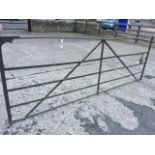 A 9ft wrought iron five-bar field gate with spigots to hinging end, and sliding bolt to the
