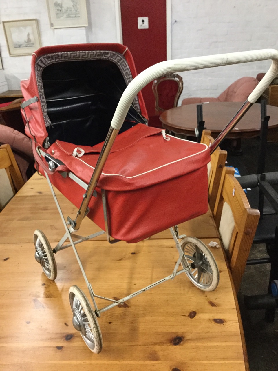 A 70s childs toy pram with vinyl detachable carrycot and cover, having concertina hood. - Image 3 of 3