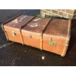 A school trunk, the hessian covered case with wood battens, leather handles and brass locks.