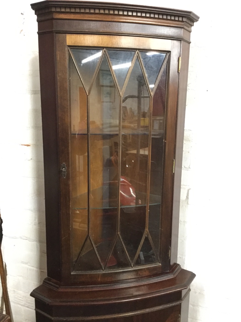 A mahogany corner cabinet with dentil cornice above astragal glazed door, the base with cupboard - Image 2 of 3