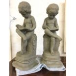 A pair of moulded composition stone cherub girls, seated on plinths reading - bookends? (16.75in) (